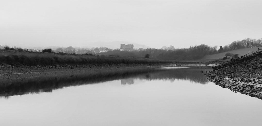 A shot of the River Ouse, misty, and in black and white.