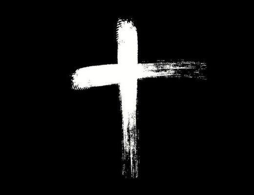 White cross on a black background. Cross as if drawn in ashes, but in negative (i.e. white on black)